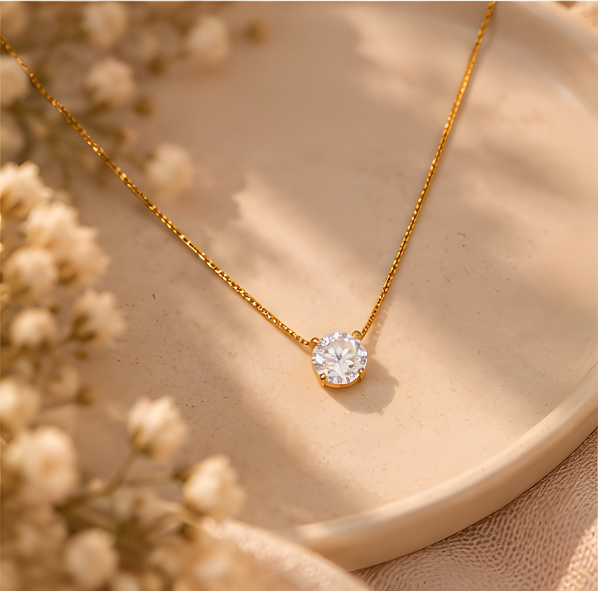 Vioras Solitaire Sparkle Pendant styled on ceramic dish