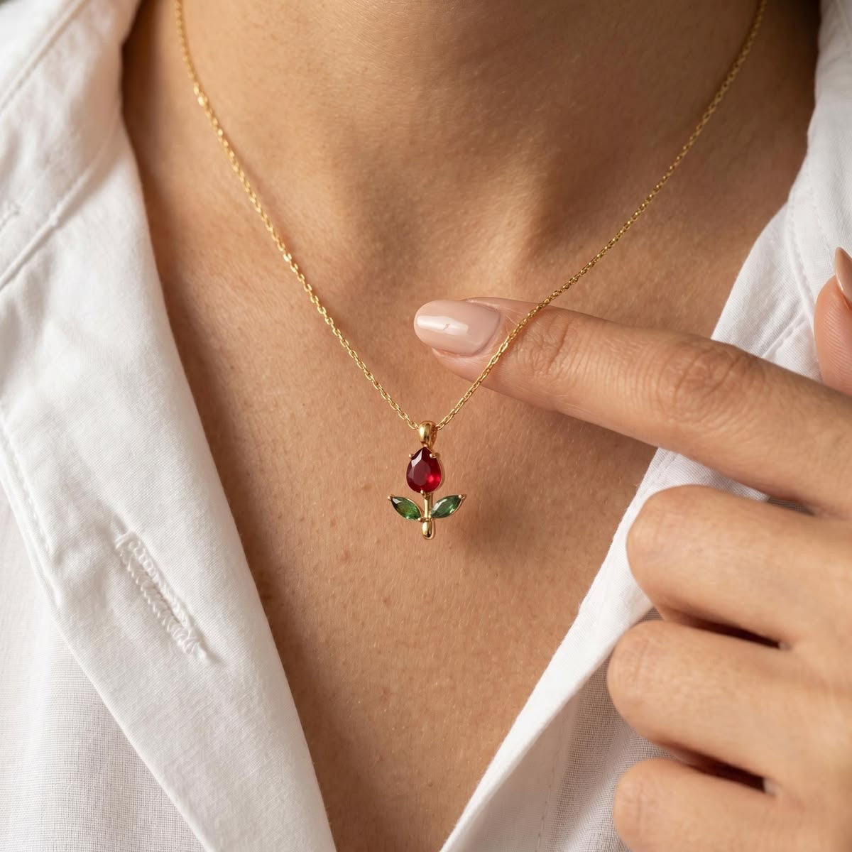 Vioras Red Tulip Pendant worn with a white shirt