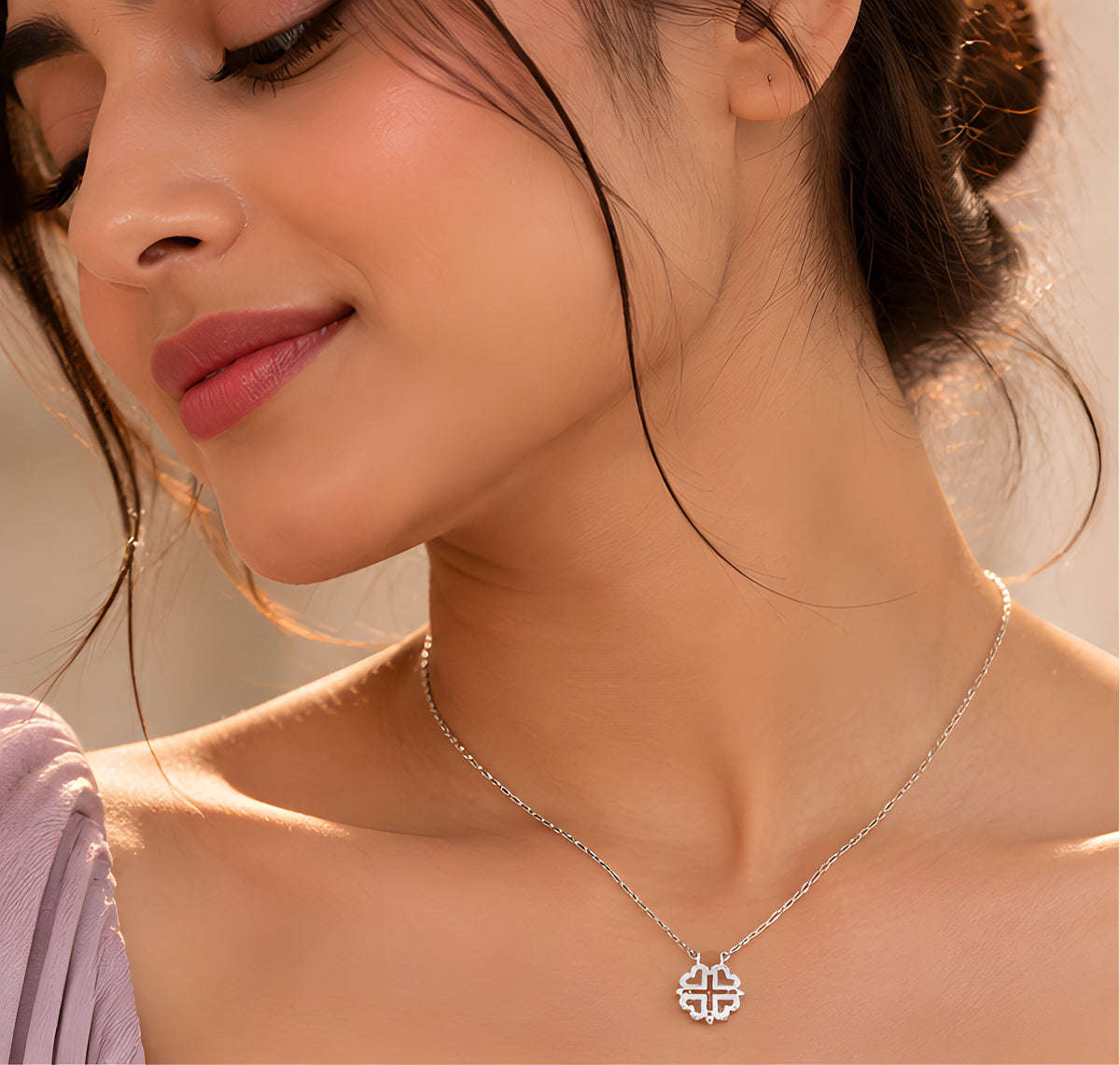 Silver 2-in-1 heart clover necklace worn on model