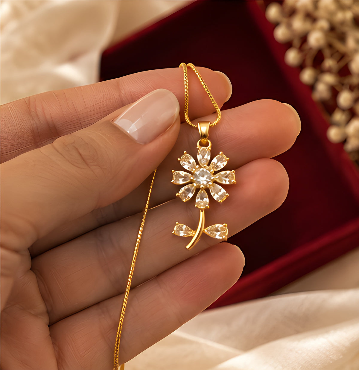 Vioras Crystal Blossom Pendant shown in hand as a gift
