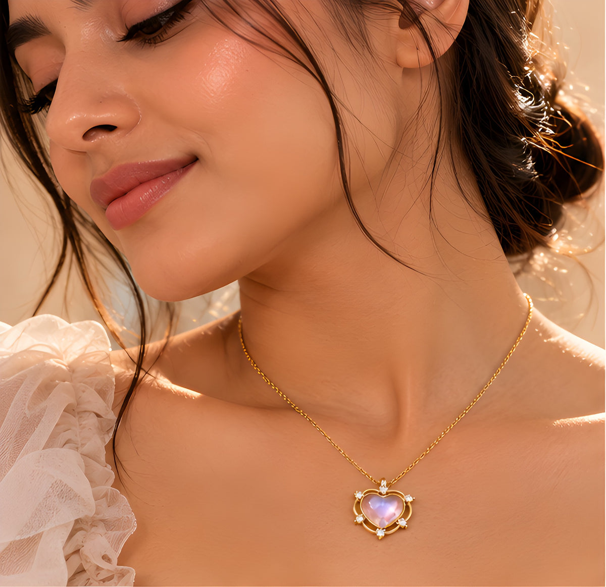 Vioras Pink Moonglow Heart Pendant in gold worn on model