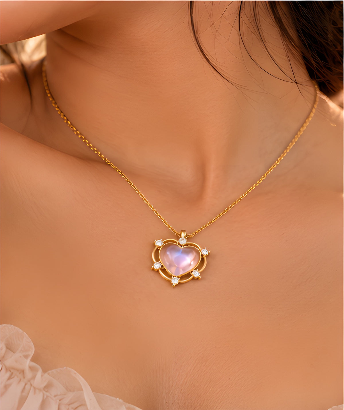 Vioras Pink Moonglow Heart Pendant styled on neckline