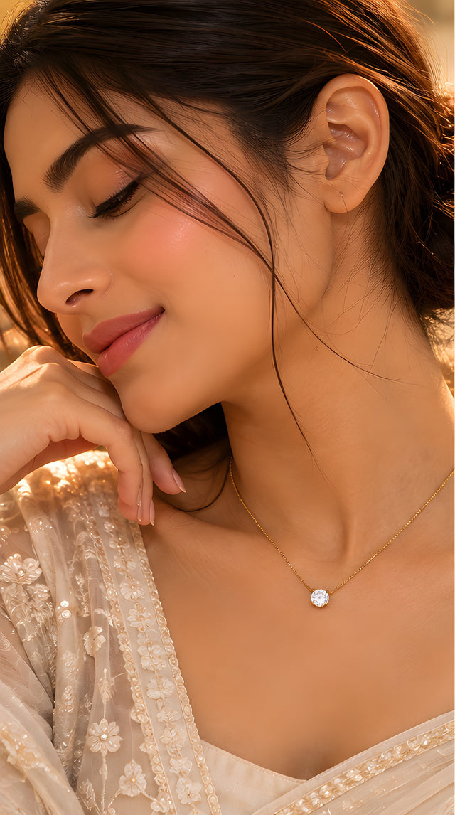Vioras Solitaire Sparkle Pendant in gold worn on model