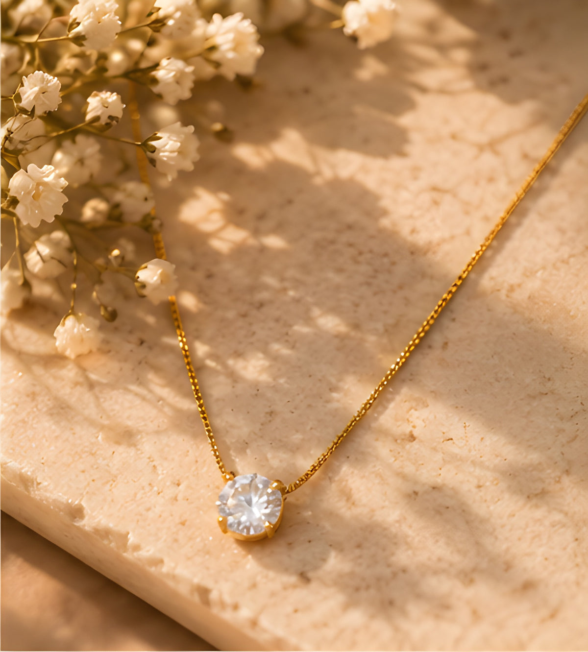 Vioras Solitaire Sparkle Pendant product flat lay on stone