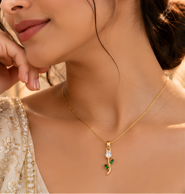 Vioras White Tulip Pendant gold worn on neckline