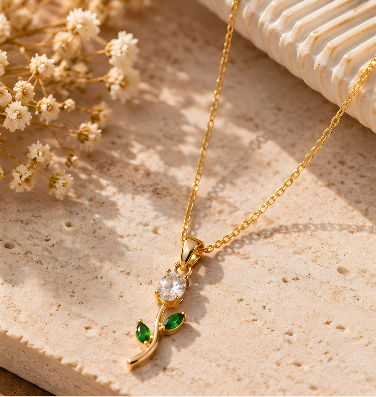 Vioras White Tulip Pendant gold product flat lay on stone