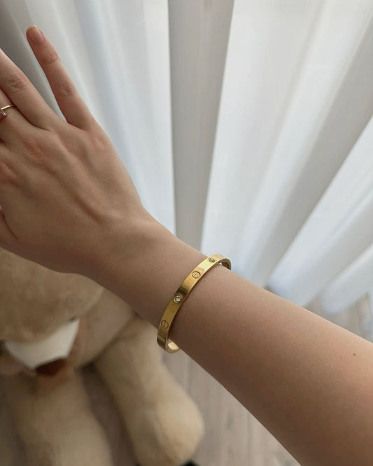 Viorass Screw Detail Crystal Bangle worn on wrist